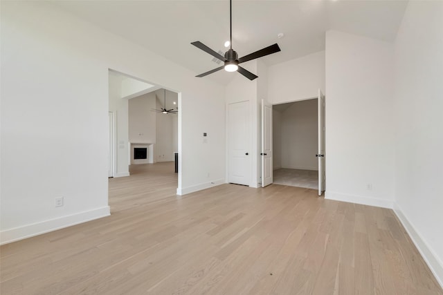 814 Montrose Dr, Rockwall, TX 75087 - unfurnished bedroom featuring vaulted ceiling, light wood-style floors, baseboards, and a ceiling fan
