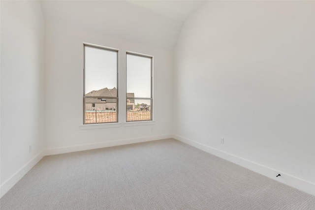 814 Montrose Dr, Rockwall, TX 75087 - empty room with light carpet, baseboards, and vaulted ceiling