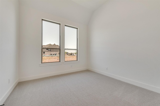 814 Montrose Dr, Rockwall, TX 75087 - spare room featuring light colored carpet, vaulted ceiling, and baseboards