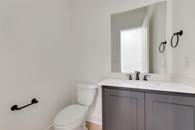 814 Montrose Dr, Rockwall, TX 75087 - half bathroom with toilet, baseboards, and vanity