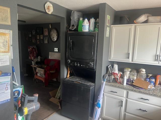 3614 Lovingood Dr, Dallas, TX 75241 - laundry area featuring stacked washing maching and dryer and laundry area