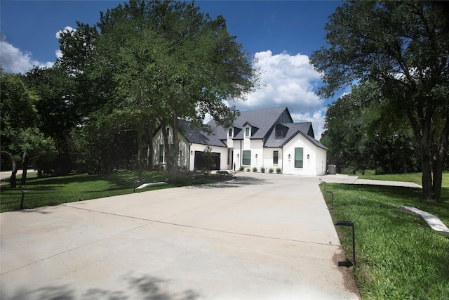 2519 Tamaron Cv, Cedar Hill, TX 75104 - view of front of property featuring concrete driveway, a front lawn, and stucco siding