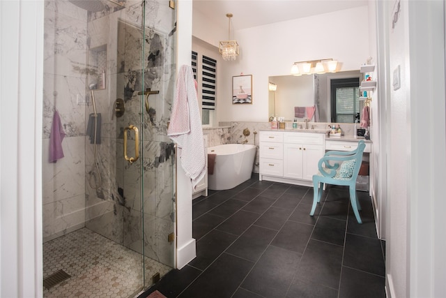 2519 Tamaron Cv, Cedar Hill, TX 75104 - bathroom with vanity, a freestanding tub, a marble finish shower, tile walls, and tile patterned floors