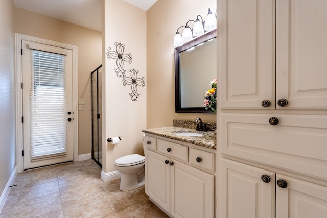 full bathroom with tile patterned flooring, toilet, vanity, baseboards, and a stall shower