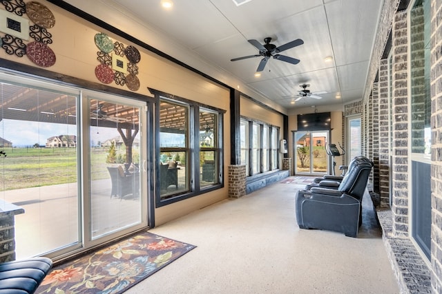 sunroom featuring ornamental molding