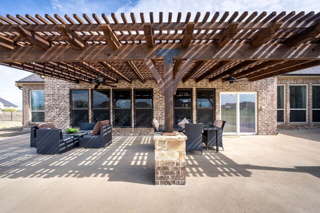 view of patio with outdoor lounge area, a ceiling fan, and a pergola