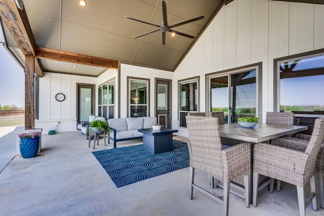 view of patio featuring an outdoor living space, outdoor dining space, and a ceiling fan