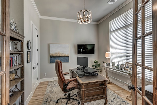 office space featuring ornamental molding, baseboards, light wood-style floors, and a chandelier