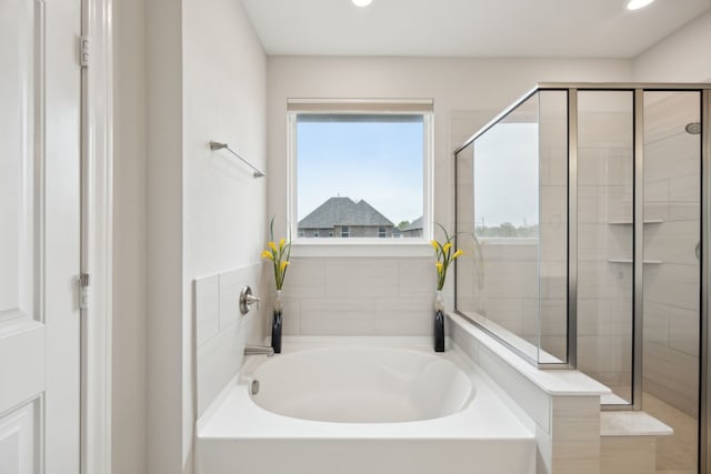 9814 Gristmill Ln, Frisco, TX 75035 - bathroom with a garden tub, recessed lighting, and a shower stall