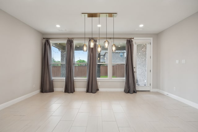 9814 Gristmill Ln, Frisco, TX 75035 - unfurnished dining area featuring baseboards and recessed lighting