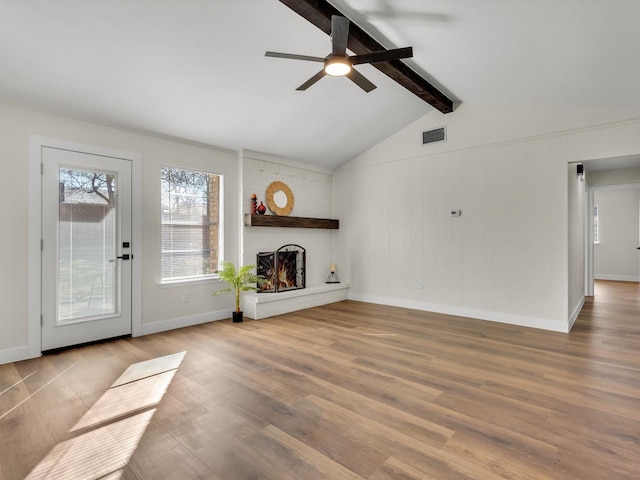 6916 Bennington Dr, Watauga, TX 76148 - unfurnished living room with a fireplace, wood finished floors, a ceiling fan, and baseboards