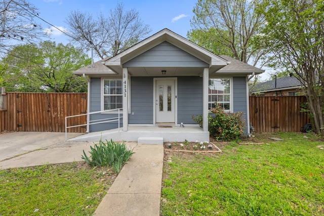 4131 Odessa St, Dallas, TX 75212 - bungalow-style house with a porch, roof with shingles, a front yard, and fence