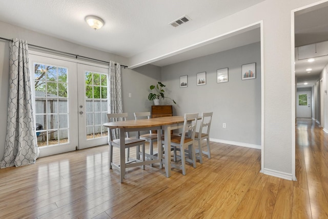 4131 Odessa St, Dallas, TX 75212 - dining room featuring baseboards, visible vents, light wood-type flooring, and french doors