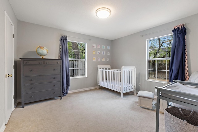 4131 Odessa St, Dallas, TX 75212 - bedroom featuring baseboards, a nursery area, and carpet