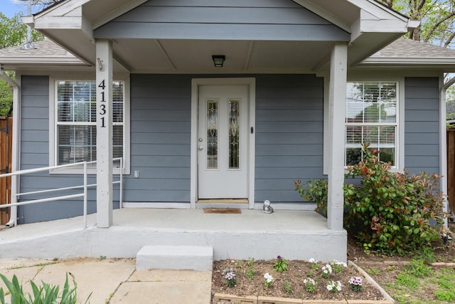4131 Odessa St, Dallas, TX 75212 - view of exterior entry with a porch and roof with shingles