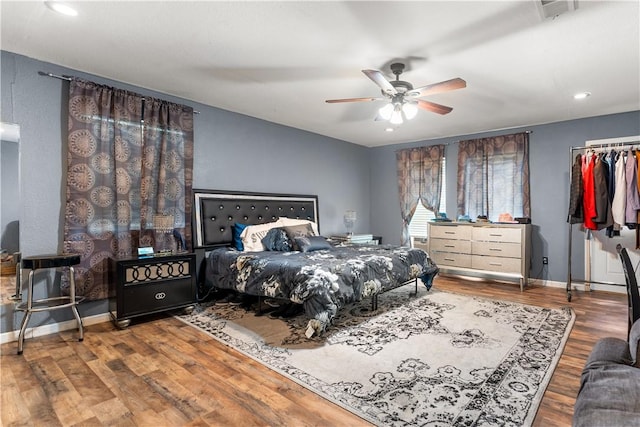 4520 Hiland Dr, Beverly Hills, TX 76711 - bedroom with a ceiling fan, wood finished floors, baseboards, visible vents, and recessed lighting
