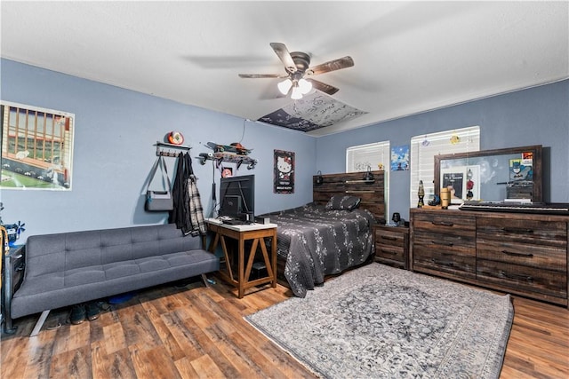 4520 Hiland Dr, Beverly Hills, TX 76711 - bedroom with ceiling fan and wood finished floors