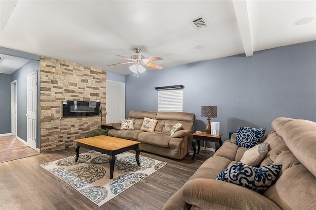 4520 Hiland Dr, Beverly Hills, TX 76711 - living room with visible vents, beamed ceiling, baseboards, ceiling fan, and wood finished floors
