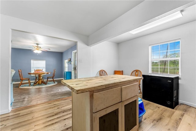 4520 Hiland Dr, Beverly Hills, TX 76711 - dining area featuring baseboards, light wood-style flooring, and a ceiling fan