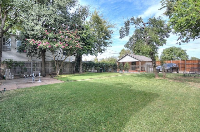 view of yard featuring a fenced backyard and a patio