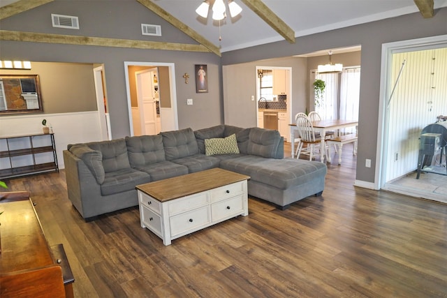 502 Parklane Dr, Bossier City, LA 71111 - living area featuring dark wood finished floors, lofted ceiling with beams, ceiling fan, and visible vents