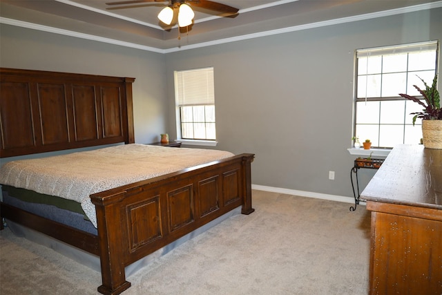 502 Parklane Dr, Bossier City, LA 71111 - bedroom with crown molding, light colored carpet, baseboards, a raised ceiling, and ceiling fan