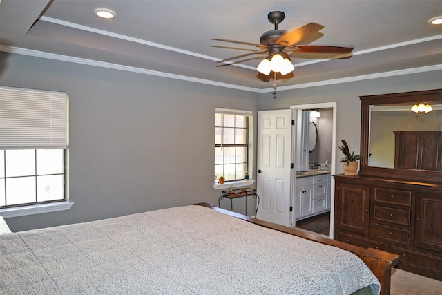 502 Parklane Dr, Bossier City, LA 71111 - bedroom featuring a tray ceiling, ensuite bathroom, and ornamental molding