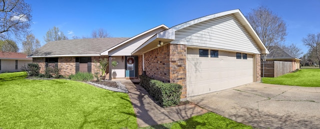 502 Parklane Dr, Bossier City, LA 71111 - ranch-style house with brick siding, driveway, a garage, and a front lawn