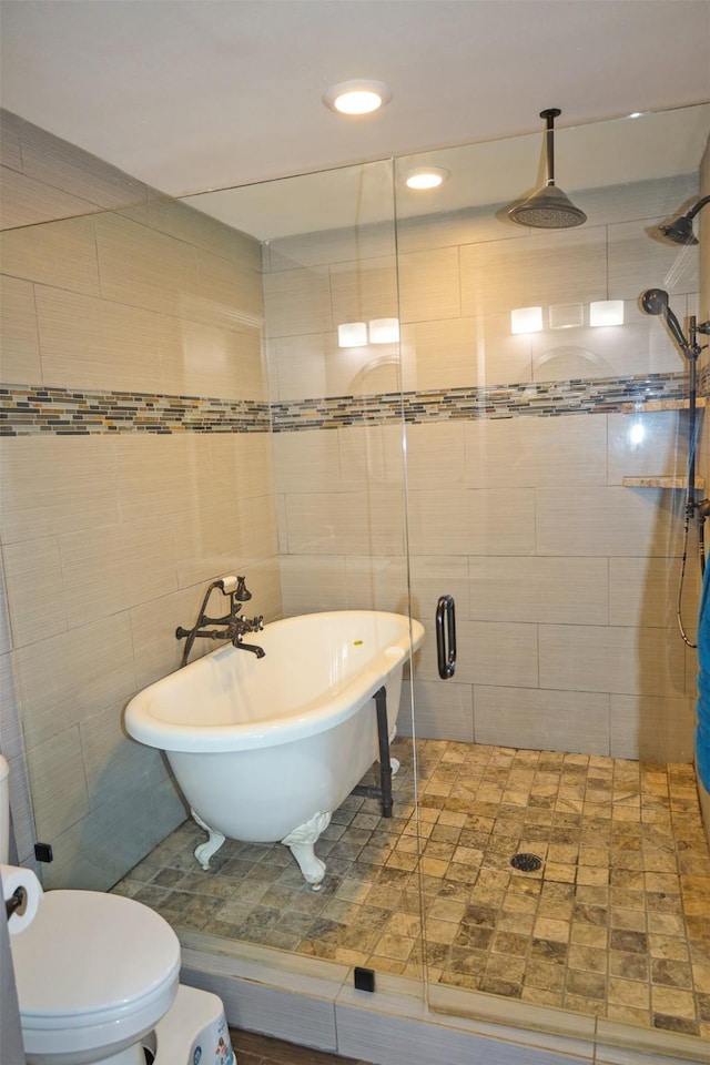 502 Parklane Dr, Bossier City, LA 71111 - bathroom featuring tile walls, toilet, recessed lighting, a stall shower, and a freestanding bath
