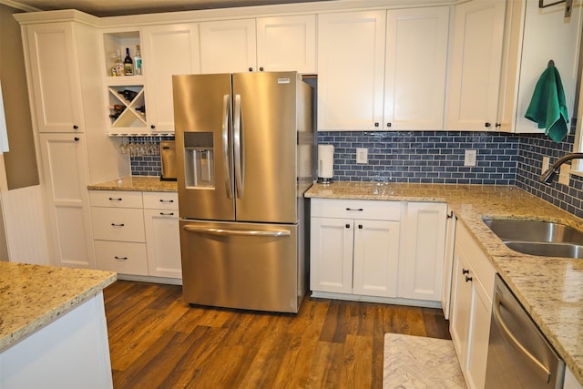 502 Parklane Dr, Bossier City, LA 71111 - kitchen featuring dark wood finished floors, a sink, white cabinetry, and appliances with stainless steel finishes