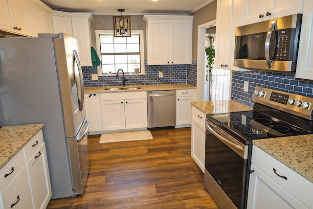 502 Parklane Dr, Bossier City, LA 71111 - kitchen with a sink, appliances with stainless steel finishes, white cabinets, ornamental molding, and dark wood-style flooring