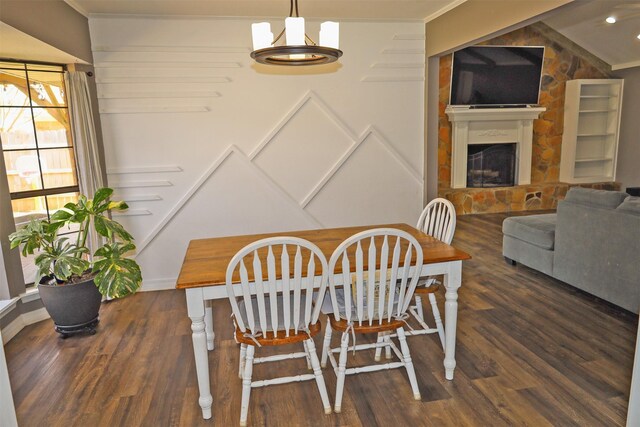 502 Parklane Dr, Bossier City, LA 71111 - dining area featuring ornamental molding, wood finished floors, an inviting chandelier, and a fireplace with raised hearth