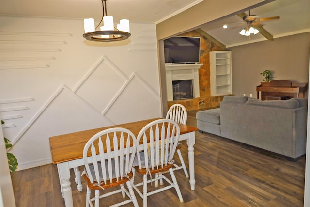 502 Parklane Dr, Bossier City, LA 71111 - dining area with a fireplace, ornamental molding, wood finished floors, ceiling fan with notable chandelier, and vaulted ceiling
