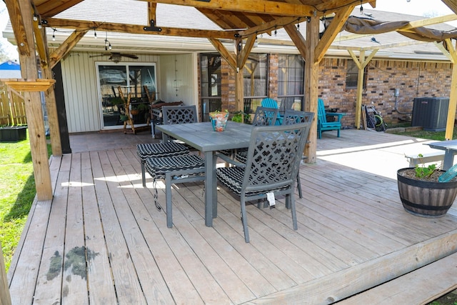 502 Parklane Dr, Bossier City, LA 71111 - deck featuring outdoor dining area, central AC, and a ceiling fan