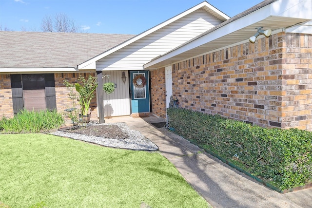 502 Parklane Dr, Bossier City, LA 71111 - doorway to property featuring brick siding and a yard
