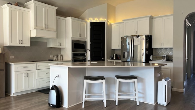 2015 Pacific Ave, Anna, TX 75409 - kitchen featuring white cabinets, a sink, stainless steel appliances, and an island with sink