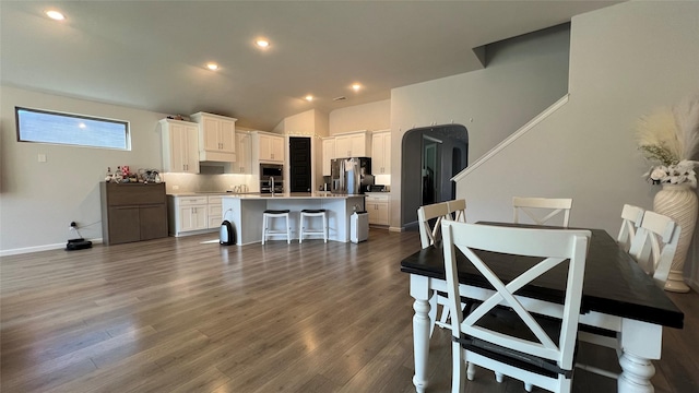 2015 Pacific Ave, Anna, TX 75409 - kitchen with a kitchen island with sink, white cabinetry, dark wood finished floors, and stainless steel appliances