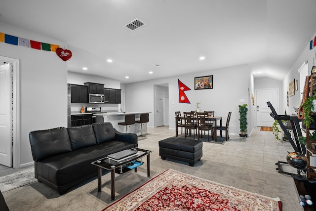 16617 Porterfield Ln, Justin, TX 76247 - living room featuring recessed lighting, baseboards, light tile patterned floors, and light colored carpet