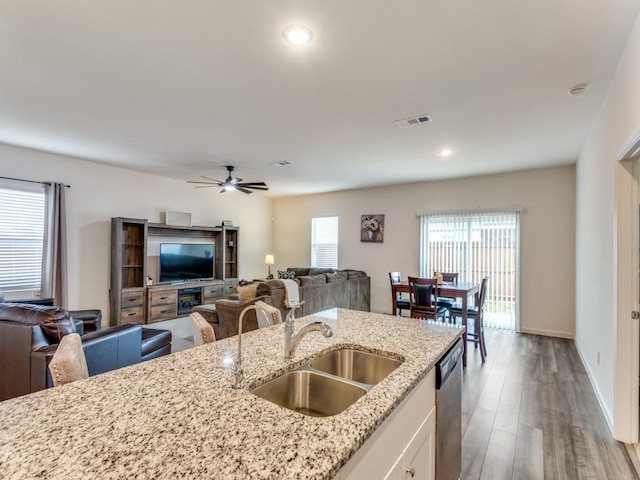 5665 Brownstone Ln, Fort Worth, TX 76036 - kitchen featuring white cabinets, a sink, visible vents, open floor plan, and recessed lighting