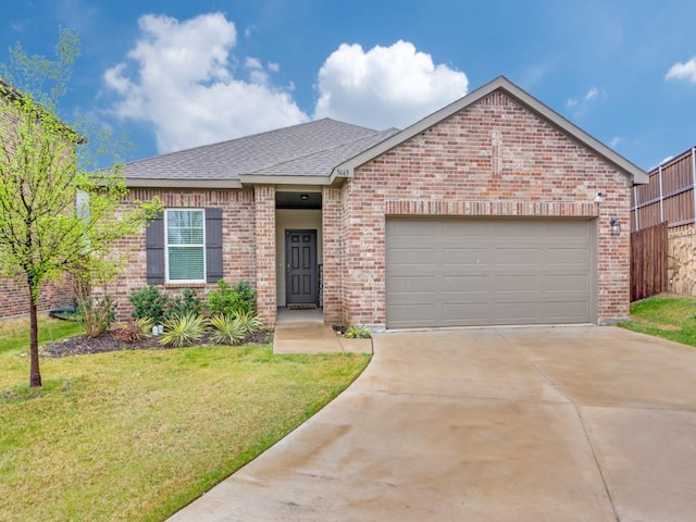 5665 Brownstone Ln, Fort Worth, TX 76036 - ranch-style house featuring concrete driveway, a front lawn, a garage, brick siding, and roof with shingles