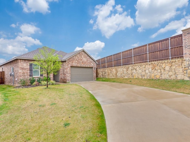 5665 Brownstone Ln, Fort Worth, TX 76036 - view of front of property with brick siding, an attached garage, concrete driveway, and fence