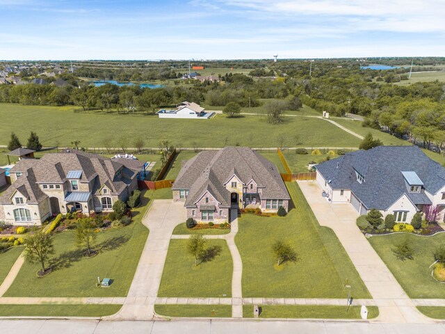 397 Mitchell Dr, Sunnyvale, TX 75182 - french country inspired facade with brick siding, a front yard, and a shingled roof