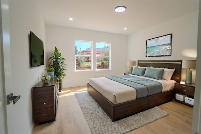 bedroom featuring recessed lighting, light wood-style flooring, and baseboards