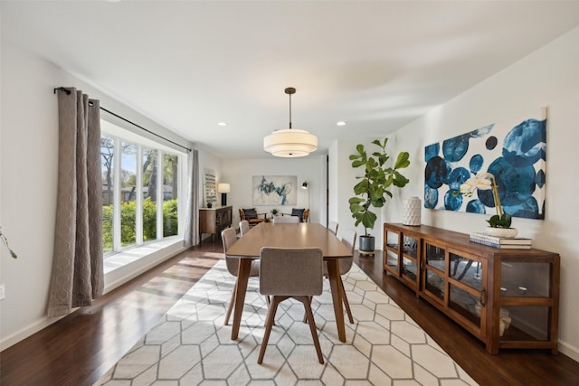 dining area featuring recessed lighting, baseboards, and wood finished floors