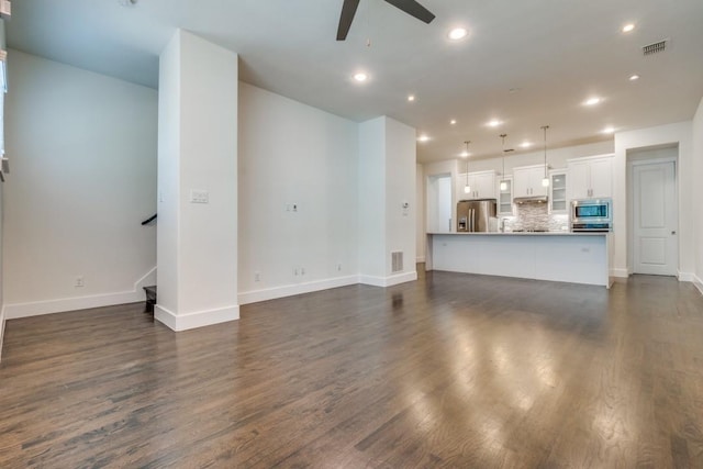 3023 Clamath Dr, Dallas, TX 75204 - unfurnished living room featuring ceiling fan, baseboards, dark wood-type flooring, and recessed lighting