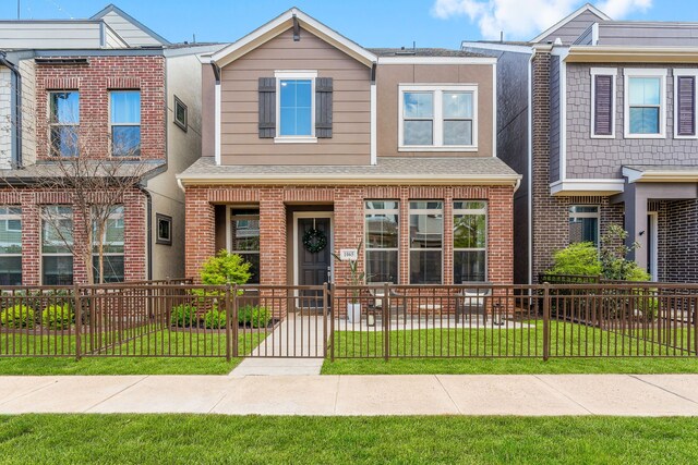 1065 Manacor Ln, Dallas, TX 75212 - view of property featuring brick siding and roof with shingles