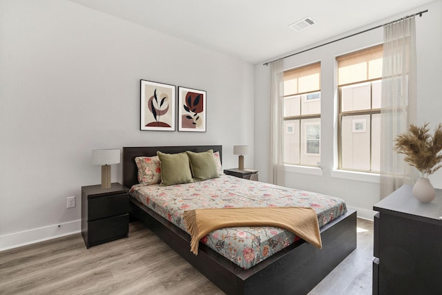 1065 Manacor Ln, Dallas, TX 75212 - bedroom with light wood-type flooring and baseboards