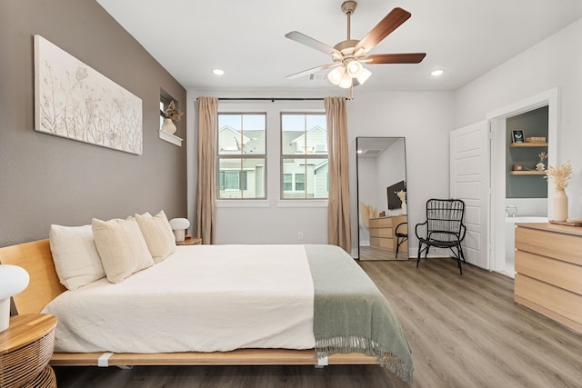 1065 Manacor Ln, Dallas, TX 75212 - bedroom with light wood-style flooring, recessed lighting, and a ceiling fan