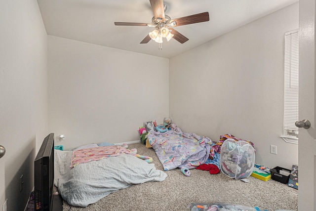 unfurnished bedroom featuring carpet floors and a ceiling fan