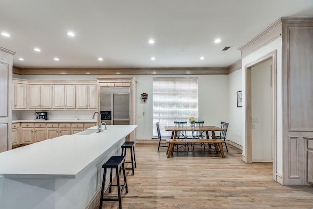 5709 Ridgehaven, Plano, TX 75093 - kitchen featuring a sink, stainless steel built in fridge, baseboards, light wood-style flooring, and light countertops